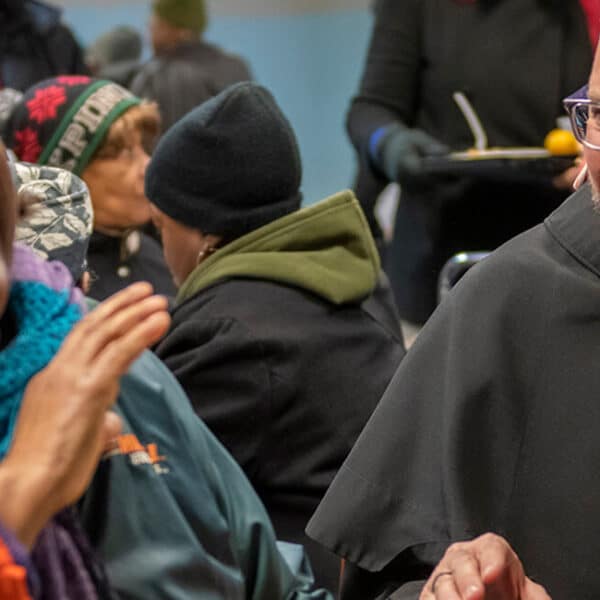 Christmas-themed dinner at Baltimore’s Franciscan Center includes help from school presidents