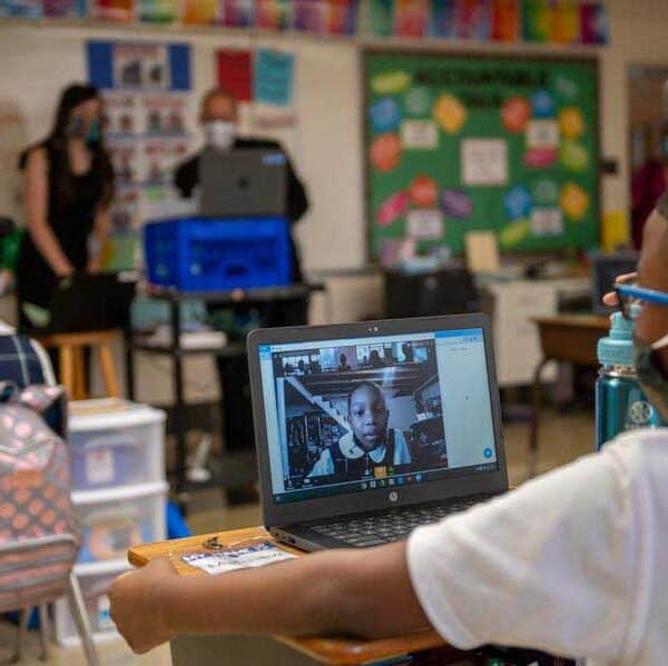 A fifth-grader at Holy Angels Catholic School connects with classmates virtually