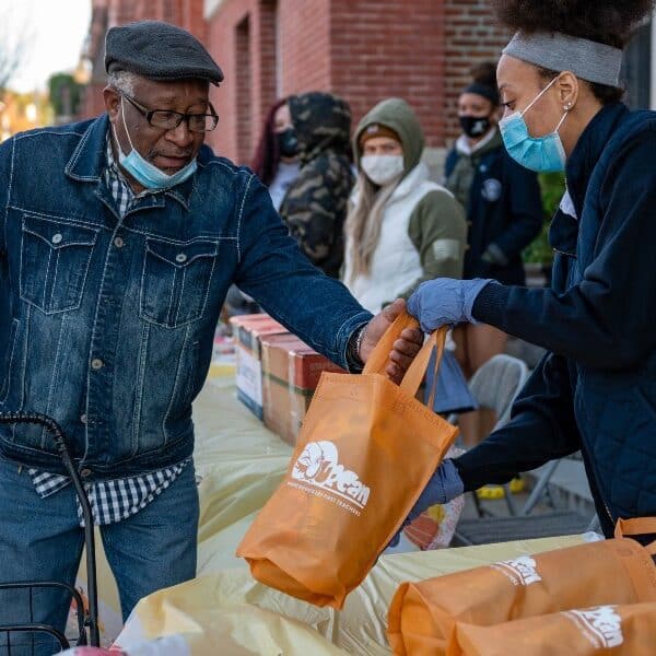 ‘Hope in a box’: Former IND students distribute Thanksgiving meals to those in need