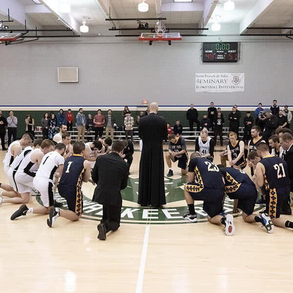 Seminarians bond over hoops, but off court meals, prayer, Mass offer fellowship too