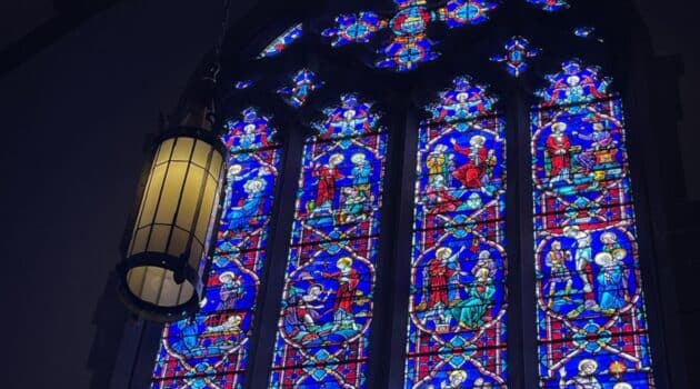 stained glass window showing scenes of Jesus' life