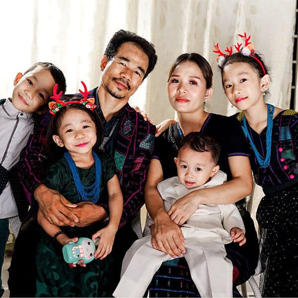 Myanmar refugee family, approved but in limbo, prays for good news while waiting to enter U.S.