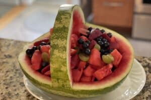 Watermelon cut into a basket and filled with fruit
