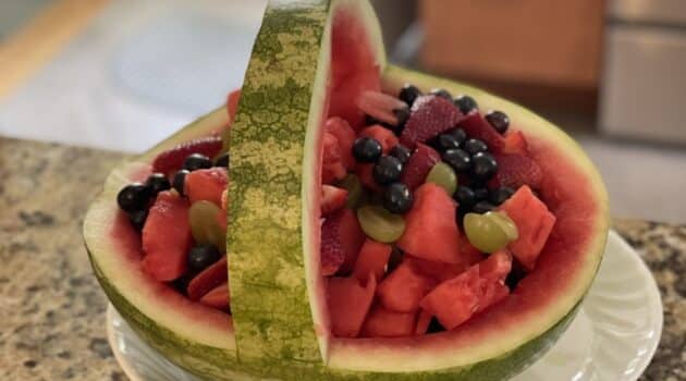 Watermelon cut into a basket and filled with fruit