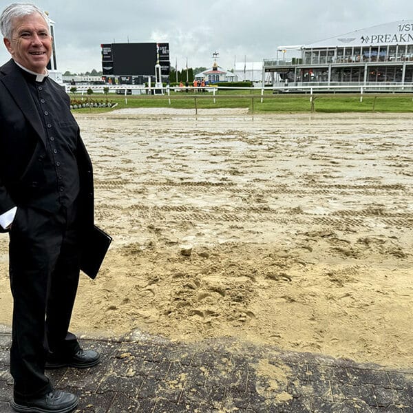 Father Patrick Carrion offers blessing before Preakness