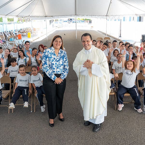 Priest, principal share award for rebuilding church and school after earthquake