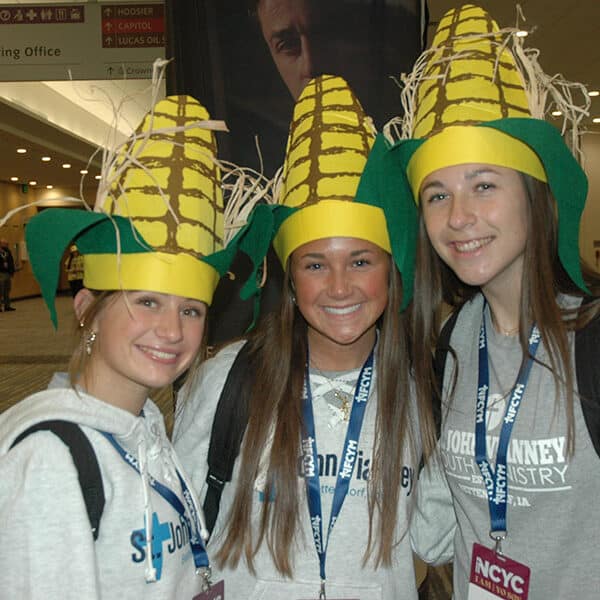Funny hats show the joy of NCYC while T-shirt messages feature the heart of youths’ faith