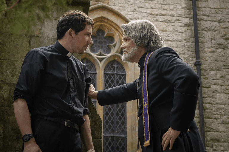 Father Jud Duplenticy (Josh O'Connor), and Msgr. Jefferson Wicks (Josh Brolin) star in a scene from the movie 