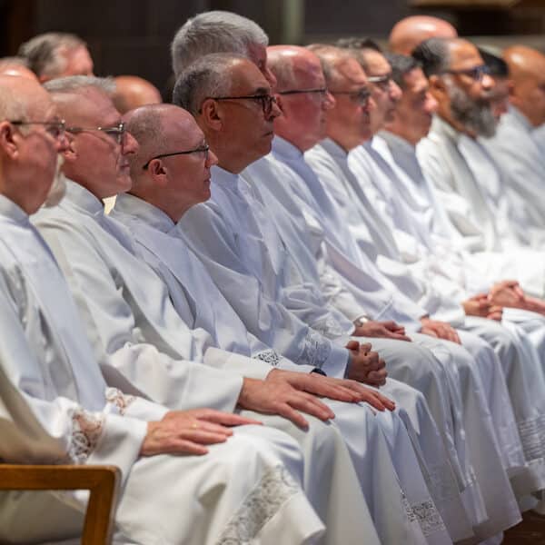 ‘Present’: Archbishop Lori ordains 14 permanent deacons at solemn, yet joy-filled Mass
