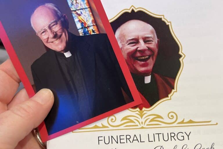 Prayer card and cover of funeral program for Msgr. Paul Cook